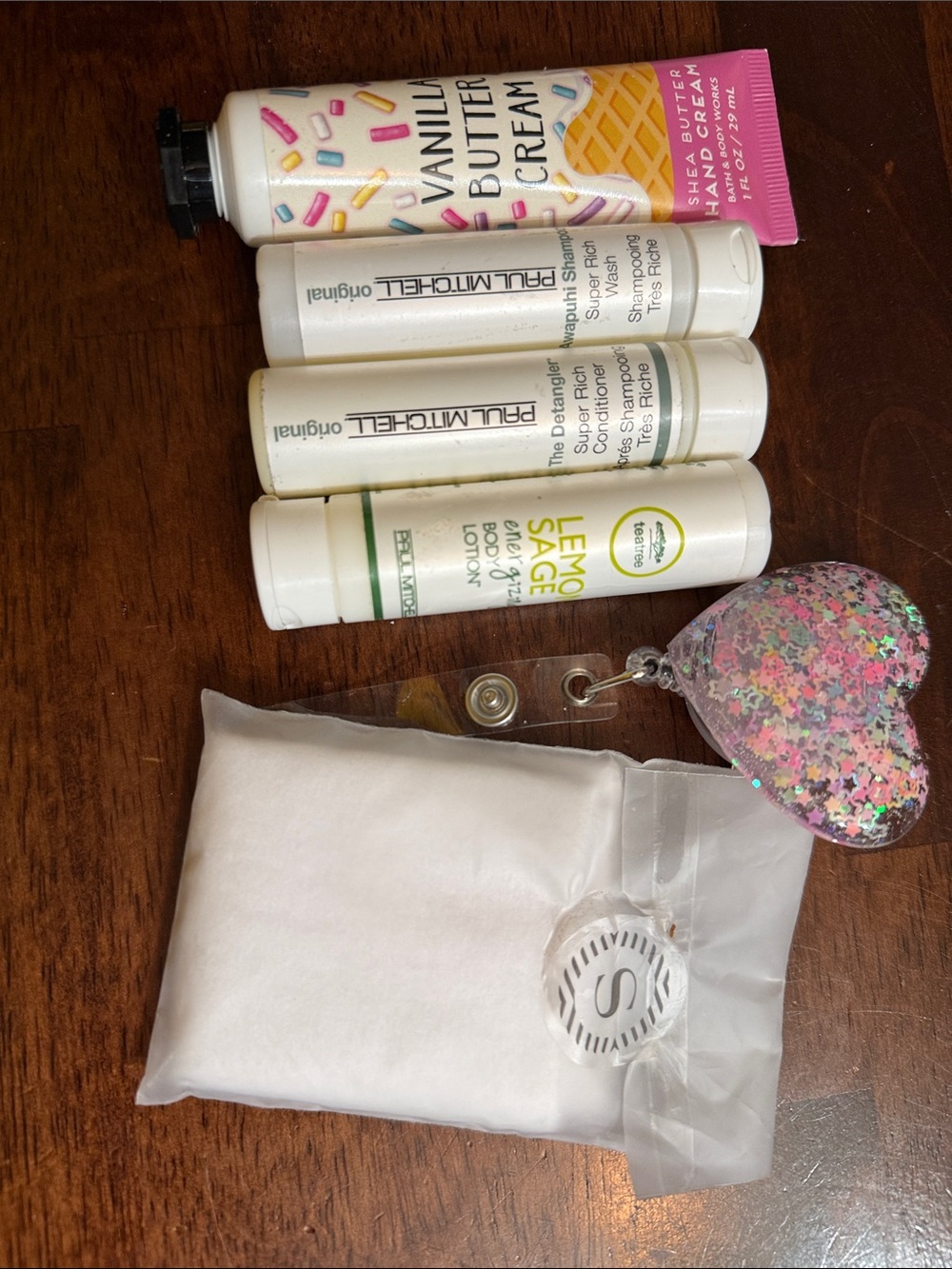 Paul Mitchell white travel hair care set with pink glitter heart charm and hand